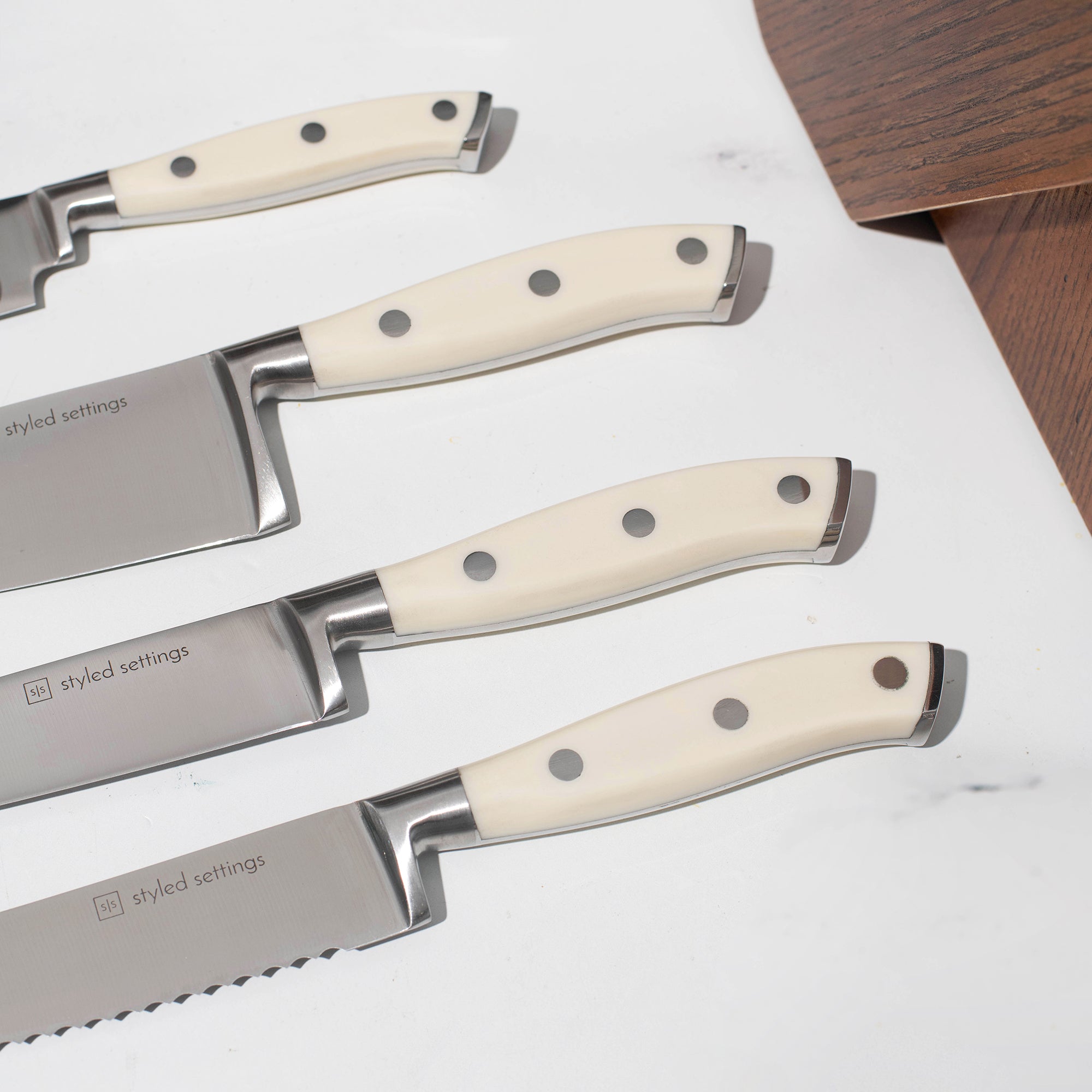 White and Silver Knife Set with Self-Sharpening Block - Styled Settings